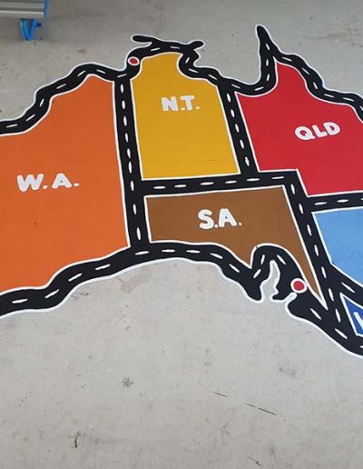 A car track drawn in the shape of Australia where children can drive their matchbox cars around Australia and a valuable teaching aid.