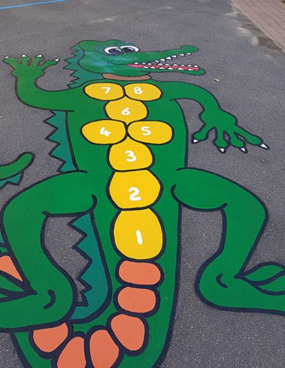 The Crocodile Hopscotch is just a basic grid of hopscotch that has been transformed into a wonderfully bright, colourful and interesting crocodile shape that the kids are drawn to.