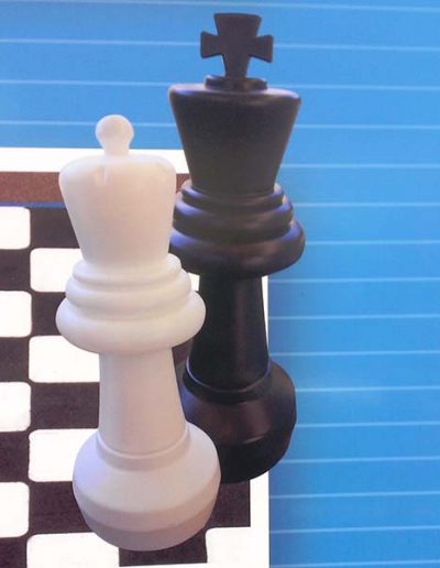 Large chess pieces for use on an outdoor playing surface