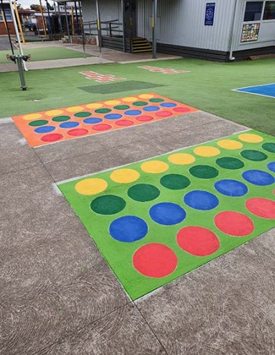 An outdoor twister board with coloured dots is a great motor skills testing out a persons sense of balance, strategy and attention to given instructions.